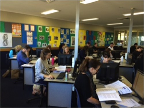 Participants reading the marking guidelines in Ballina